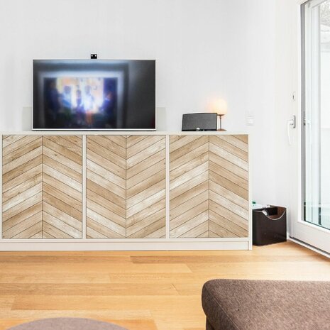 plakfolie hout visgraat op tv kastje